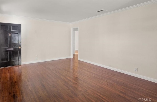 unfurnished living room featuring dark hardwood / wood-style flooring and crown molding