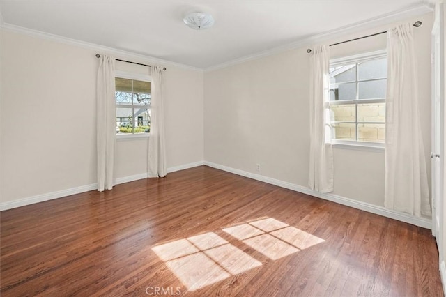 empty room with wood-type flooring and ornamental molding