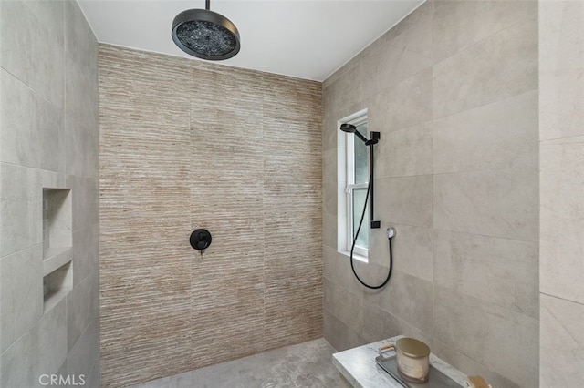 bathroom with a tile shower