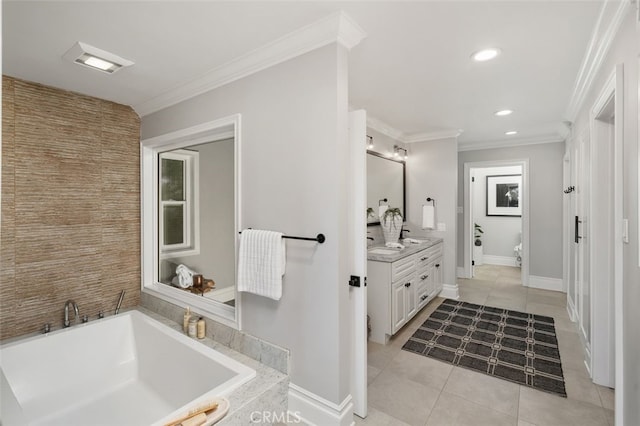 bathroom with tile patterned flooring, vanity, crown molding, and a tub