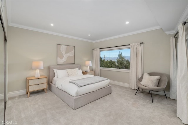 bedroom featuring ornamental molding and light carpet