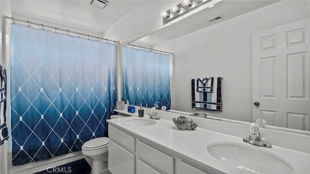 bathroom with vanity, toilet, and a shower with shower curtain