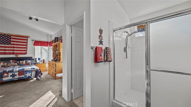 bathroom with lofted ceiling and an enclosed shower