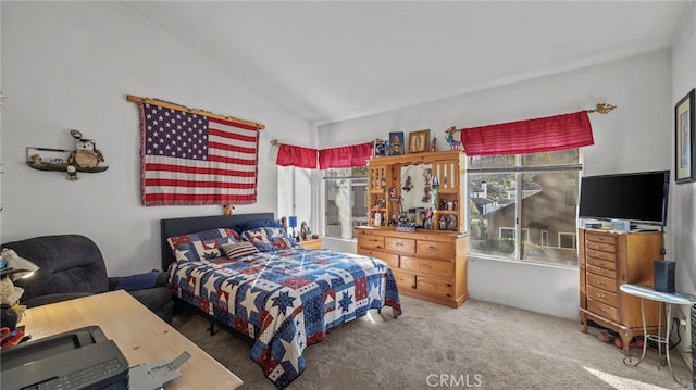 bedroom featuring carpet flooring and vaulted ceiling