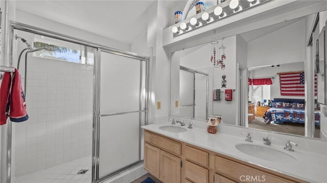 bathroom with walk in shower, lofted ceiling, and vanity