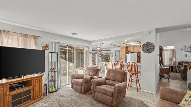 living room featuring light tile patterned floors