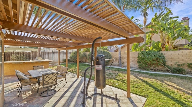 view of patio featuring exterior bar and a pergola