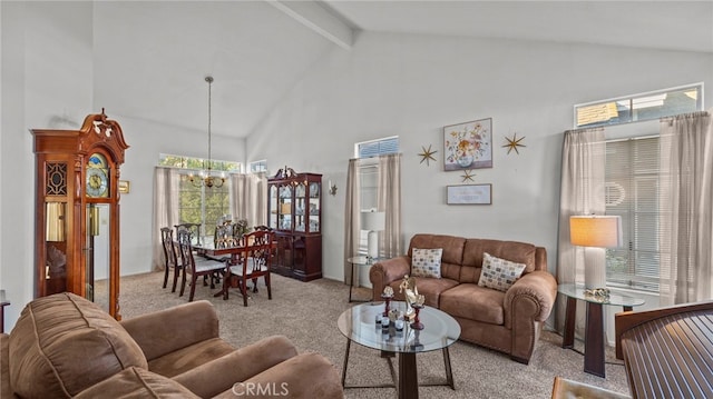 carpeted living room featuring beamed ceiling, a chandelier, and high vaulted ceiling