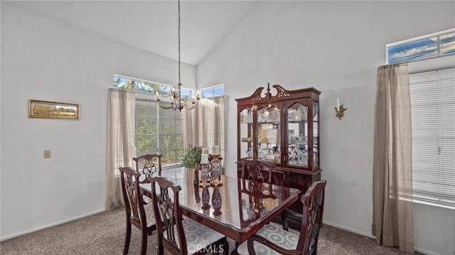 dining room featuring vaulted ceiling, carpet floors, and a chandelier