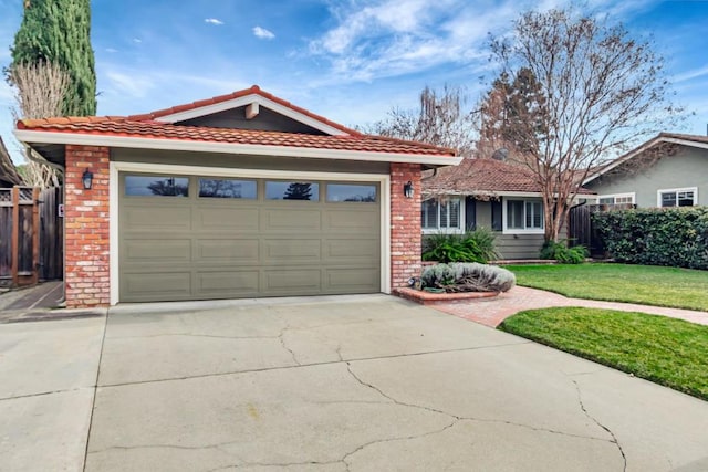 ranch-style home featuring a garage and a front lawn