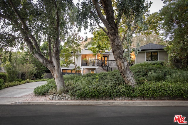 view of property hidden behind natural elements