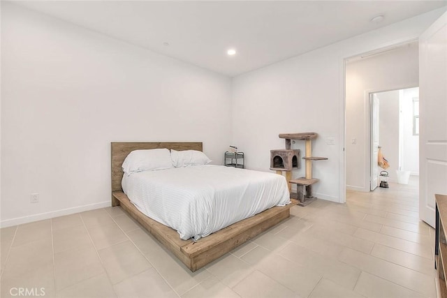 bedroom with light tile patterned flooring