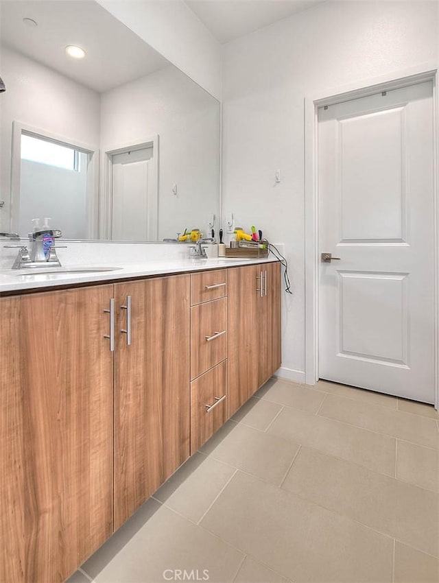 bathroom featuring vanity and tile patterned flooring