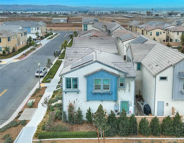 birds eye view of property featuring a mountain view