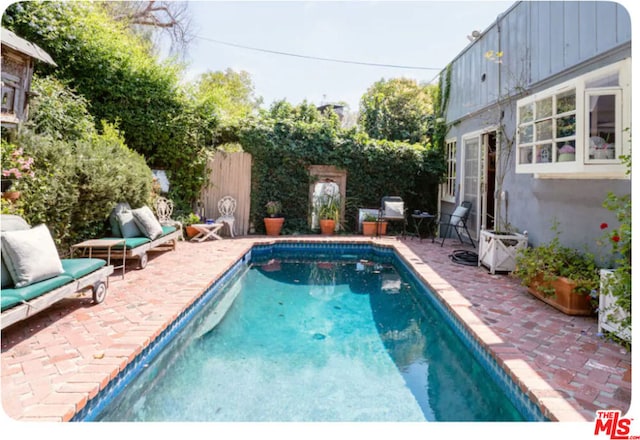 view of pool featuring a patio