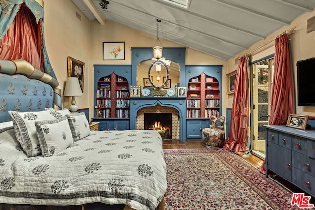 bedroom featuring vaulted ceiling with beams and dark wood-type flooring