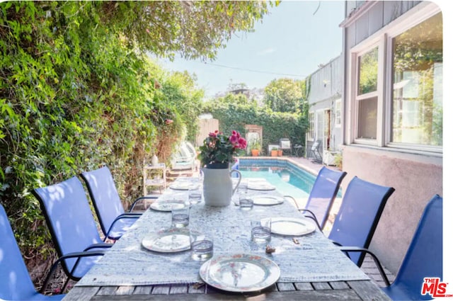 view of patio / terrace featuring a fenced in pool