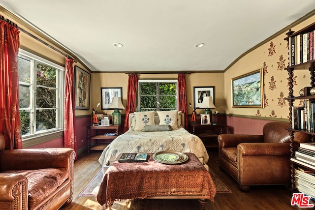 bedroom featuring hardwood / wood-style flooring and crown molding