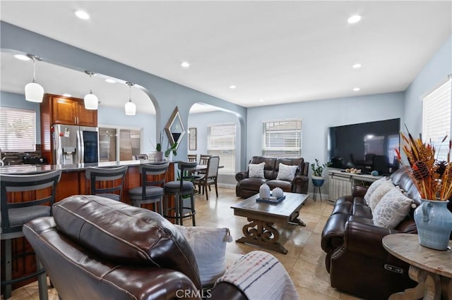 tiled living room featuring a wealth of natural light