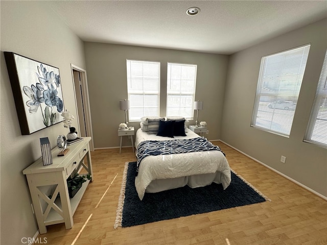 bedroom with light hardwood / wood-style flooring