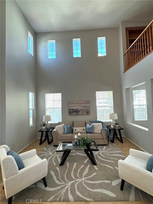 living room with a healthy amount of sunlight and light hardwood / wood-style floors