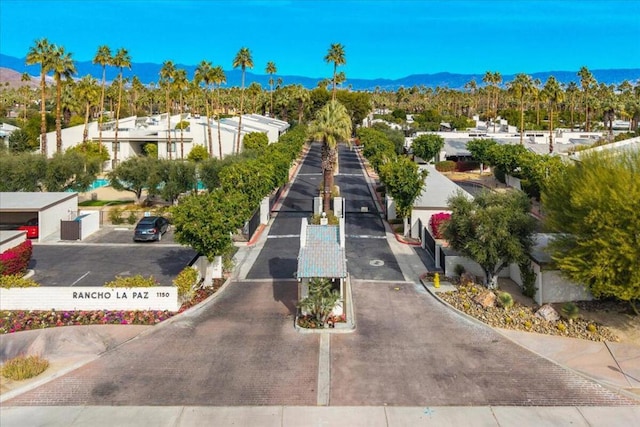 birds eye view of property featuring a mountain view