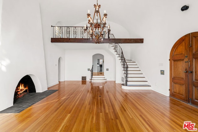 foyer entrance featuring hardwood / wood-style flooring and a chandelier