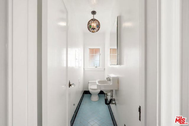 bathroom featuring sink and toilet