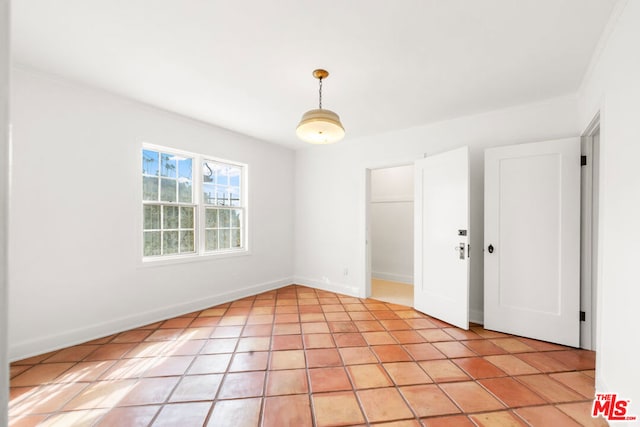 empty room with light tile patterned floors