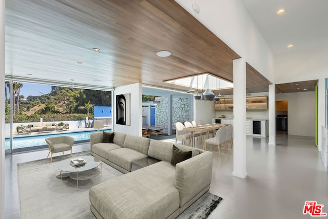 interior space with wood ceiling and concrete floors