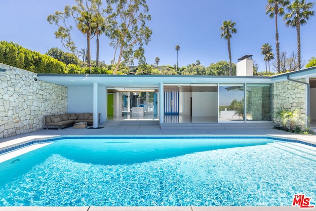 view of pool featuring a patio area