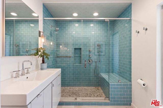 bathroom featuring vanity and walk in shower