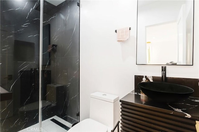 bathroom featuring walk in shower, vanity, and toilet