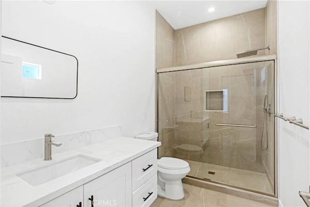 bathroom featuring vanity, an enclosed shower, tile patterned floors, and toilet