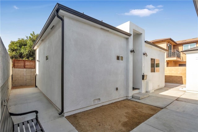 back of property featuring a patio area