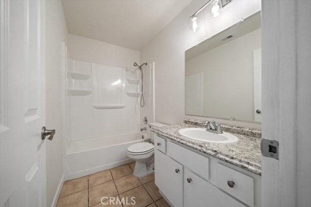 full bathroom featuring washtub / shower combination, tile patterned floors, toilet, and vanity