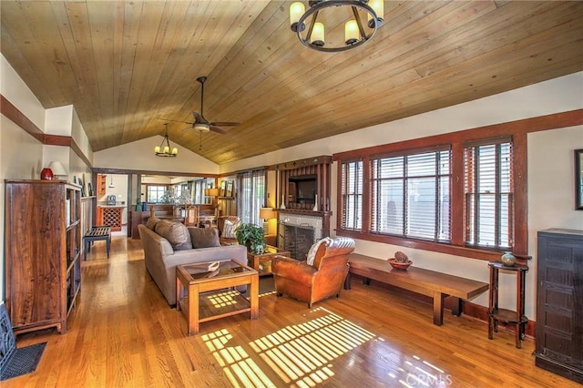 living room with lofted ceiling, wood ceiling, and light hardwood / wood-style flooring