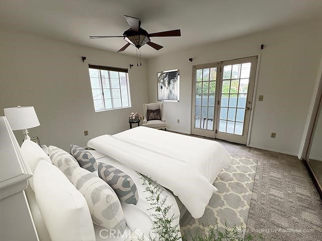 bedroom featuring a ceiling fan, baseboards, access to outside, and multiple windows