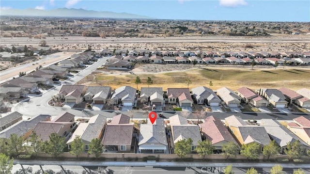 drone / aerial view featuring a mountain view