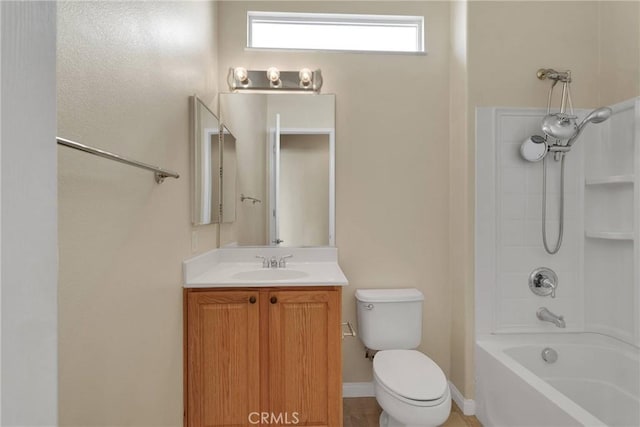 full bathroom with  shower combination, vanity, and toilet