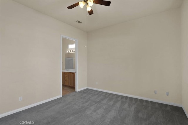 carpeted empty room featuring ceiling fan