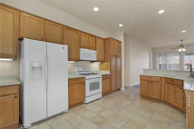 kitchen with white appliances and ceiling fan