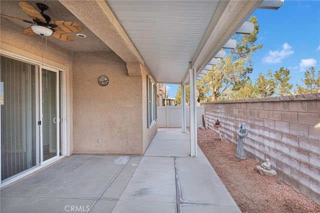 view of patio featuring ceiling fan