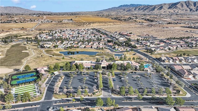 birds eye view of property featuring a water and mountain view