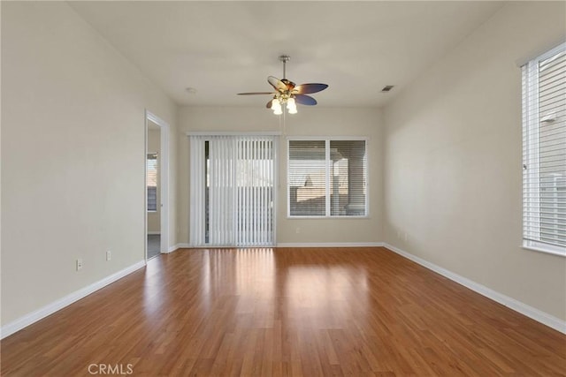 unfurnished room featuring hardwood / wood-style flooring and ceiling fan