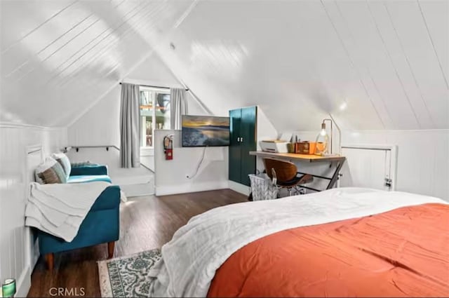 bedroom with lofted ceiling and dark hardwood / wood-style flooring