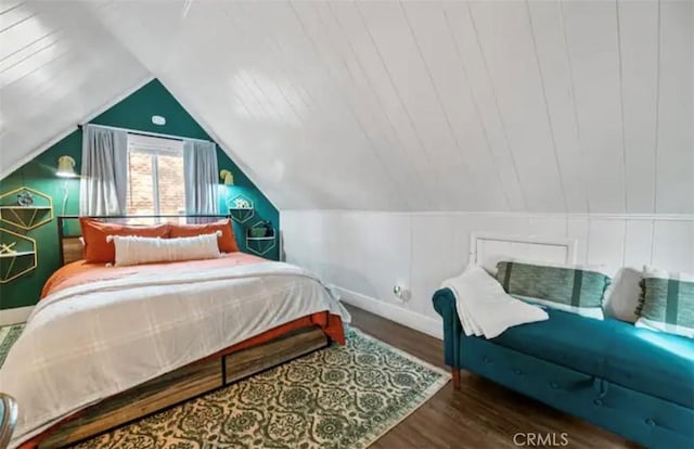 bedroom with dark hardwood / wood-style flooring and lofted ceiling