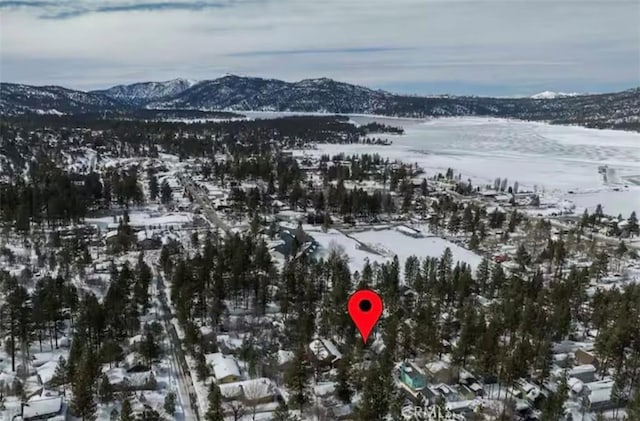 snowy aerial view featuring a mountain view