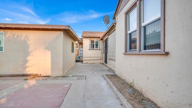 view of side of property with a patio area