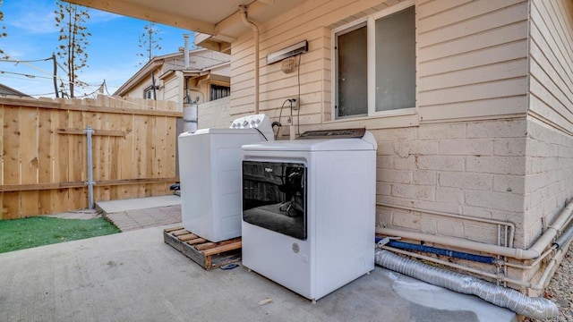 washroom featuring washer and dryer